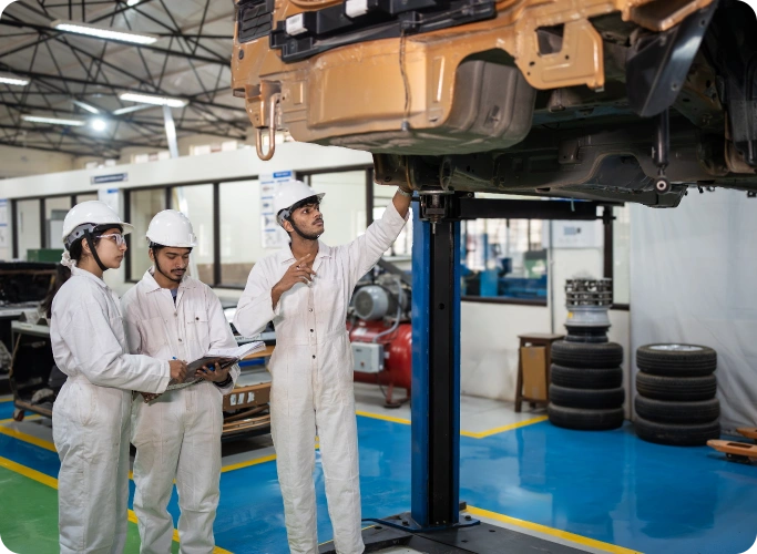 Students working in an automotive laboratory